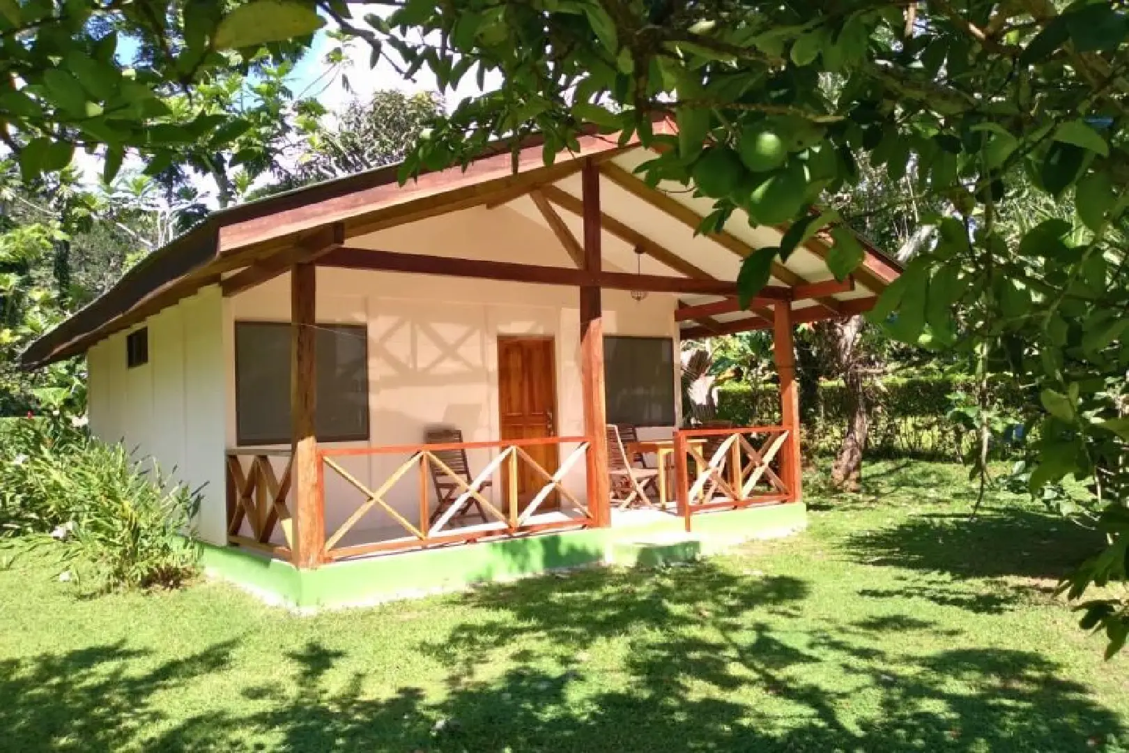 A small house with a porch and patio.