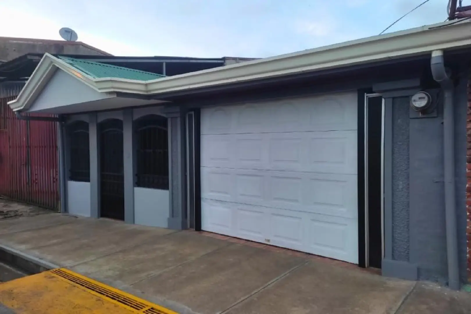 A garage door that is open on the side of a building.